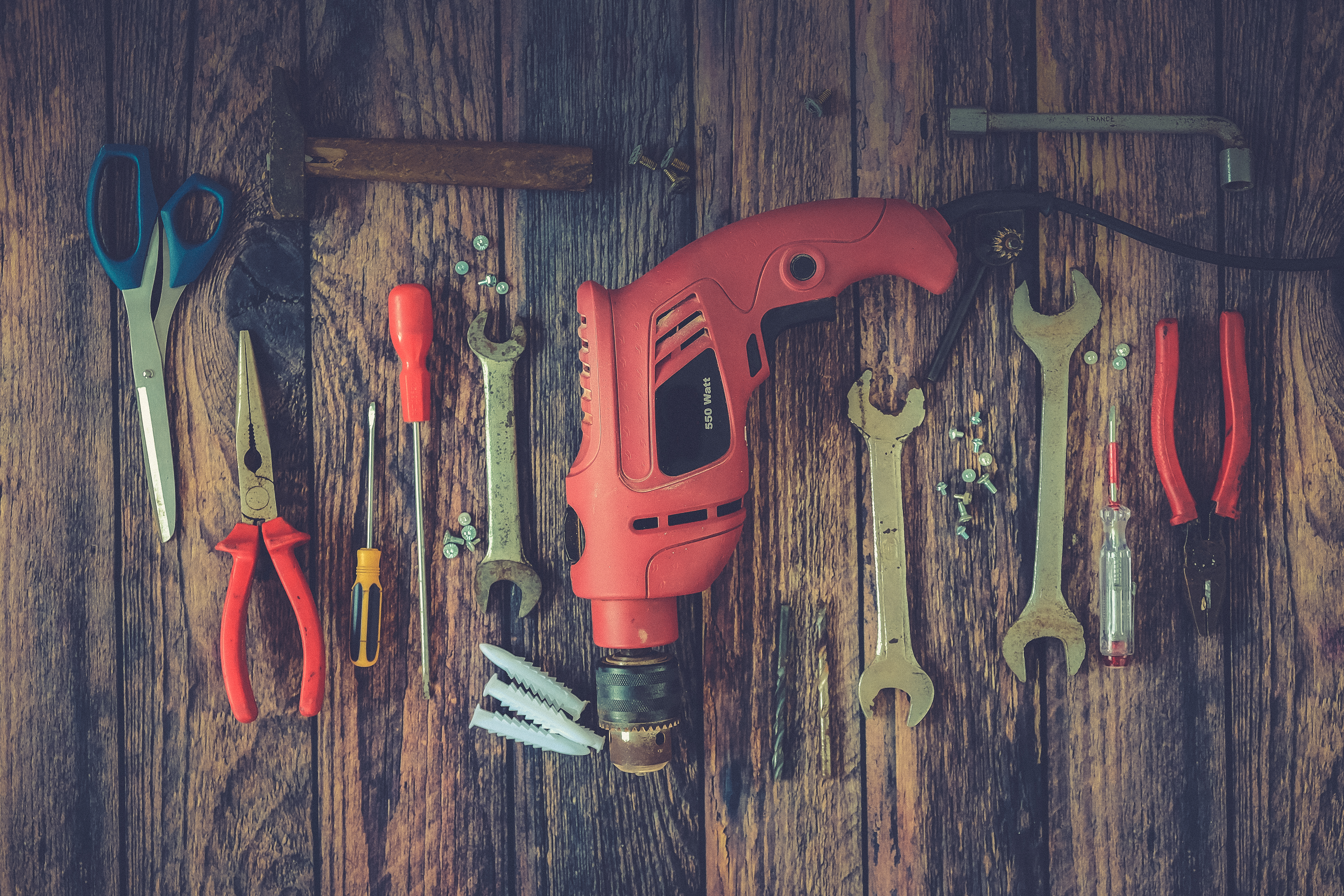 Hand Tools on Wood Background